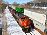 <b><i>Tanks and racks speeding eastbound.</i></b> CN 8010, IC 2708 and BNSF 4349 speed by with an oil train (CN 710). At right is CN 120, whose head end had passed just 30 second before. For more train photos, click <a href=http://www.flickr.com/photos/mtlwestrailfan/>here.</a>