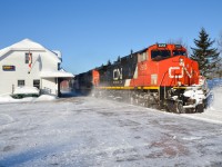 CN 2653, CN 5263 and CN 2322 are eastbound past the Hervey Jonction station with CN 368 on the scenic Lac St-Jean sub on a beautiful but frigid morning. For more train photos, click <a href=http://www.flickr.com/photos/mtlwestrailfan/>here.</a>