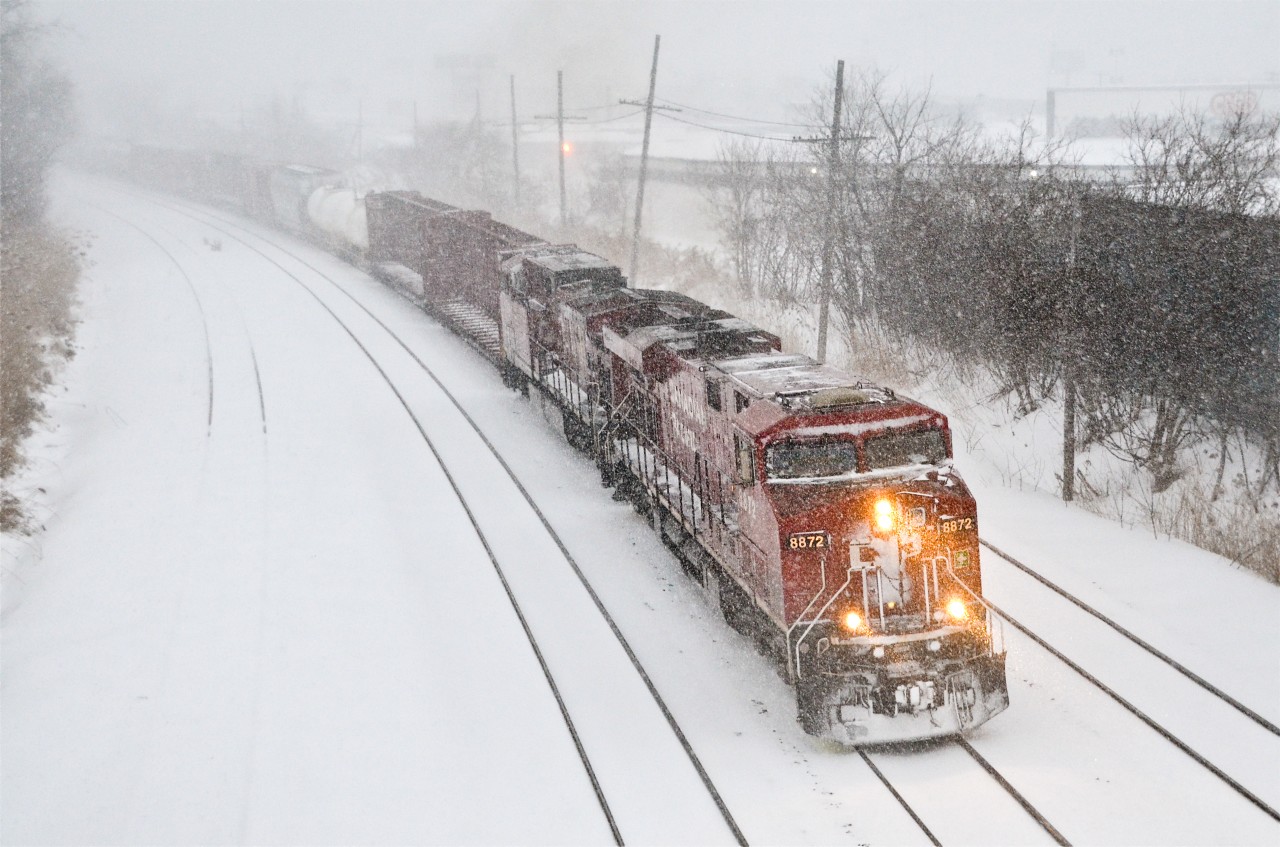 CP power on CN. CN 529 heads west through Montreal West during a major snowstorm, about 12 hours later than usual. Normally this train has NS power (or occasionally CN or UP) but here it has two CP units, CP 8872 and an unidentified AC4400CW. Until it is interchanged to CN at Rouses Point NY, this train is known as CP 931. For more train photos, click here.
