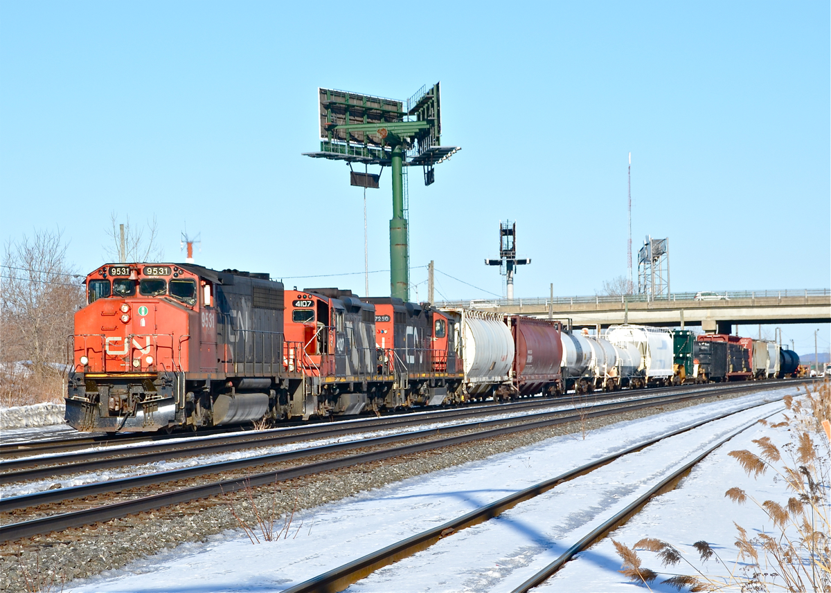 CN 9531, CN 4107 and CN 7250 depart Southwark yard with a much shorter than usual CN 527 on a warm and sunny afternoon (CN 527 often runs to 100+ cars). They will head to Taschereau Yard and let CN 401 and VIA 59 pass them in the process. For more train photos, click here.