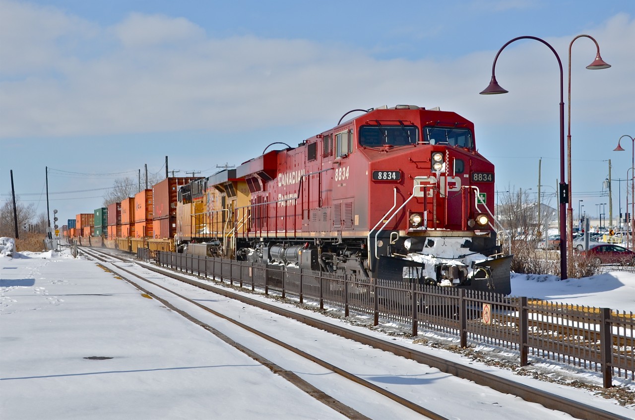 CP 8834 and UP 5510 head east through AMT Dorval Station. For more train photos, click here.