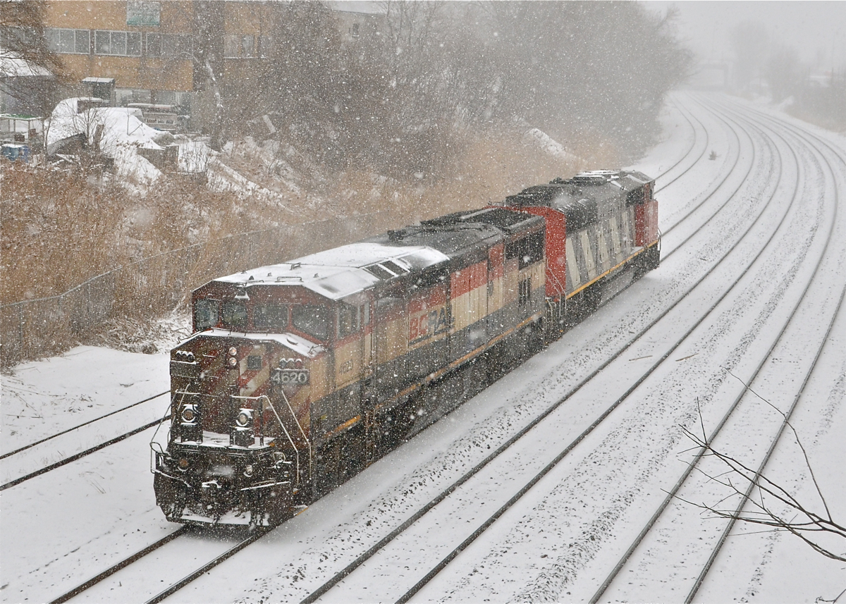 Spring? What spring?! During a snowstorm, BCOL 4620 and CN 5543 were switching CN 149, but their must have been problems with the engines as the power would depart westwards light, to be replaced by two CN Dash9's an hour later. For more train photos, click here.