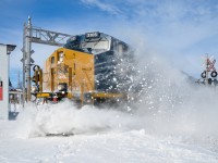<b><i>Snow bank busting!</i></b> CN 327 (with CSXT 3105 and CSXT 867) heads south towards Huntingdon, passing through the town of Saint-Stanislas-de-Kostka and sending the snow flying at a crossing. For more train photos, click <a href=http://www.flickr.com/photos/mtlwestrailfan/>here.</a>