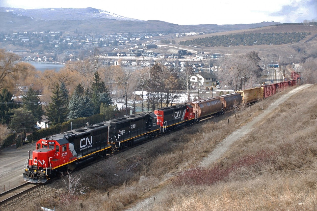 CN(WC)3026 is the lead unit on this eastbound freight as it runs alongside Kalamalka Rd. in the District of Coldstream.