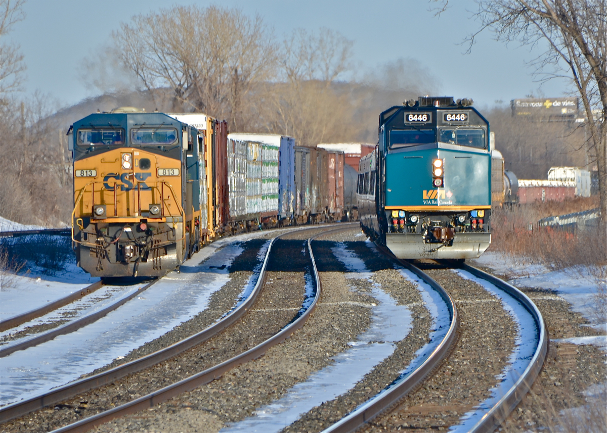 CN 327 with the usual pair of CSX units (813 & 3138) cool its heels as VIA 59 with VIA 6446 leading passes by moments before making its station stop at Dorval. For more train photos, click here.