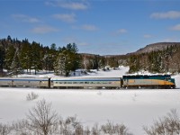 VIA 6424, a coach and a baggage car make up VIA 601 as it heads towards Jonquière on CN's scenic Lac St-Jean sub. For more train photos, click <a href=http://www.flickr.com/photos/mtlwestrailfan/>here.</a>