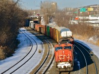 CN 5718 & CN 2102 head west through Montreal West about an hour and a half before sunset. For more train photos, click <a href=http://www.flickr.com/photos/mtlwestrailfan/>here.</a>