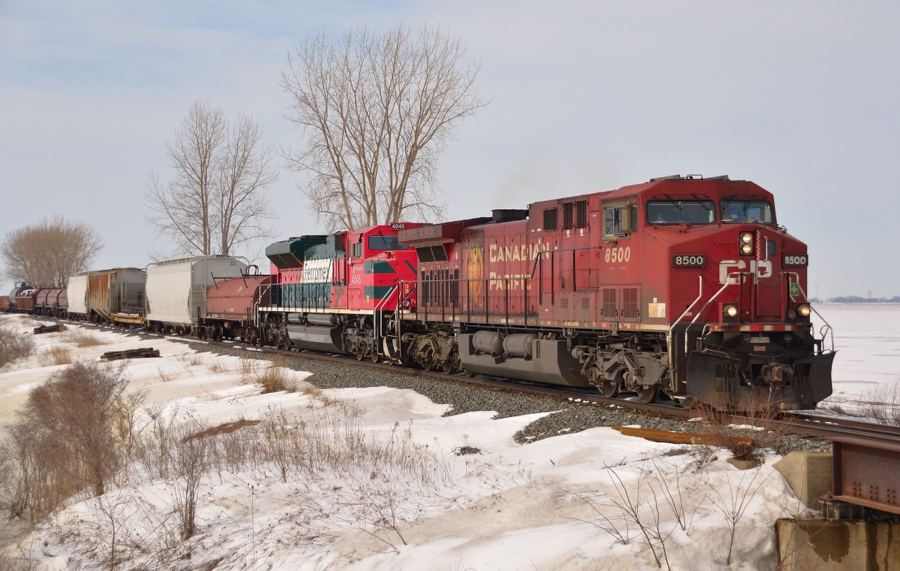 CP 242 passes eastbound thru Jeannette mile with class leader CP 8500 and an odd foreign visitor in FXE 4045.