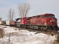 CP 242 passes eastbound thru Jeannette mile with class leader CP 8500 and an odd foreign visitor in FXE 4045.