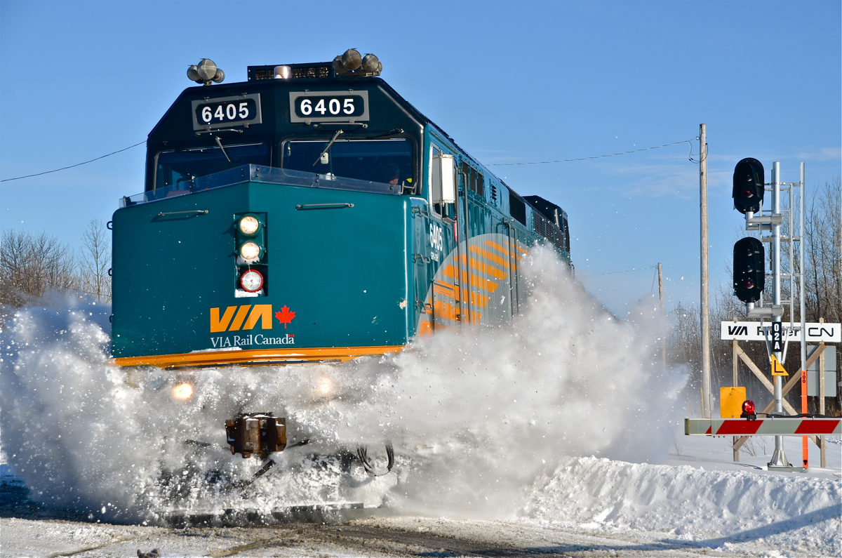 VIA 6405 makes short work of some accumulated snow at a crossing while on its way to Ottawa. For more train photos, click here.