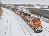 <b>Double CN 529. </b> Because of the snowstorm, yesterday's and today's CN 529 were joined together and are seen here passing through Montreal West with BNSF 1123, BNSF 5347, CN 2417 & NS 9654 for power. For more train photos, click <a href=http://www.flickr.com/photos/mtlwestrailfan/>here.</a>