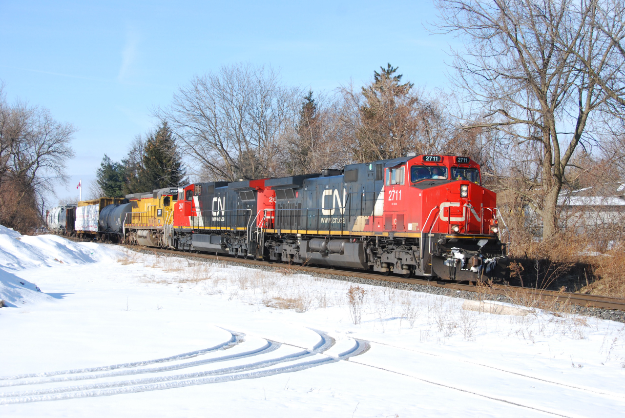 CN A422 slows as it enters Niagara Falls passing through the Stamford neighbourhood from which this subdivision takes its name.  The third unit is a recently activated ex-CREX, nee-UP C40-8 still in UP paint.