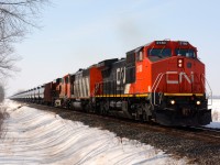 CN2180 with help from CN5515 and BN6590 move slowly past Plowing Match Road with about 100 tankers.