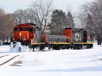 CN7245 with slug 222 and CN7264 plough through the snow on their way to the Cargill elevator in Sarnia.