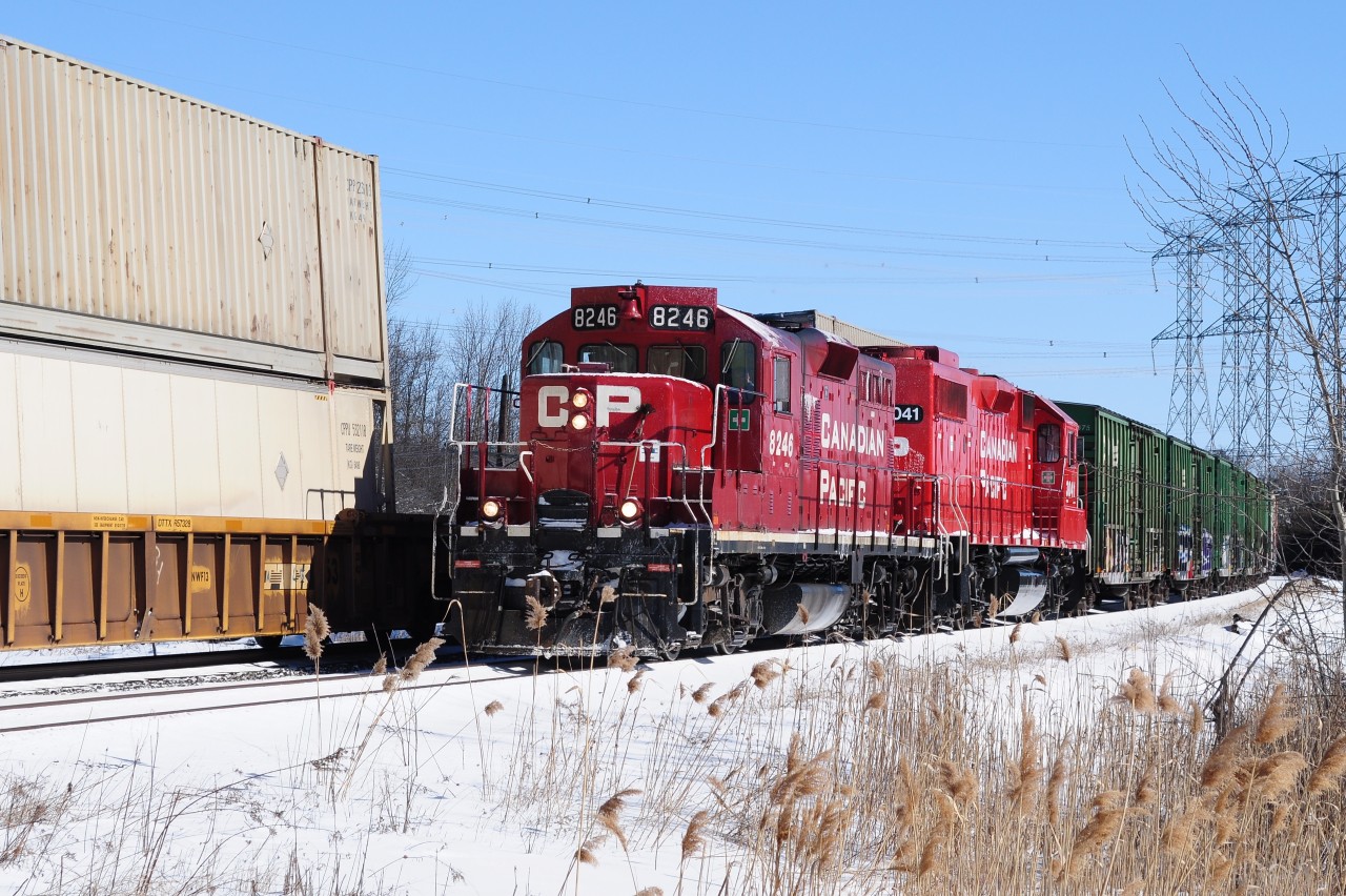 Sure is nice to see first generation unit GMD GP9u leading (even if it is chopped and re-built) over a GE AC4400CW of any stripe !


How much longer CP 8246 ( the  former  8825 GMD GP9, 1959 ) will be around remains to be seen and coupled with GP 38-2 (GMD 1985) 3041, hopefully the latter will be around for some time.


CP 8246 west – a management trainee special -  is in the Cherrywood  siding for another (what else) GE AC4400CW (GE 2004): CP 9835 east with distributed power another (what else) GE AC4400CW (GE 2004): CEFX 1057.


8246 's consist: a string of sixty ( or so ) of ancient fifty foot reefers & boxes, primarily CP forest product and Soo Line reefers...been a long time since I have seen a solid box car train  –  even if all empties ! 


At Cherrywood, March 13, 2013 image by S. Danko.


More GP 38's leading:


  Cobourg turn  


sdfourty.