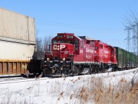 Sure is nice to see first generation unit GMD GP9u leading (even if it is chopped and re-built) over a GE AC4400CW of any stripe !
<br>
<br>
How much longer CP 8246 ( the  former  8825 GMD GP9, 1959 ) will be around remains to be seen and coupled with GP 38-2 (GMD 1985) 3041, hopefully the latter will be around for some time.
<br>
<br>
CP 8246 west – a management trainee special -  is in the Cherrywood  siding for another (what else) GE AC4400CW (GE 2004): CP 9835 east with distributed power another (what else) GE AC4400CW (GE 2004): CEFX 1057.
<br>
<br>
8246 's consist: a string of sixty ( or so ) of ancient fifty foot reefers & boxes, primarily CP forest product and Soo Line reefers...been a long time since I have seen a solid box car train  –  even if all empties ! 
<br>
<br>
At Cherrywood, March 13, 2013 image by S. Danko.
<br>
<br>
More GP 38's leading:
<br>
<br>
<a href="http://www.railpictures.ca/?attachment_id=5923">  Cobourg turn </a> 
<br>
<br>
sdfourty.