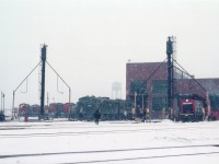 Stopping by the Fort Erie CN shop on a miserable cold snowy day in February, 38 years ago as this is posted, one can see a variety of units, mostly switchers and GP9s. The only locomotive ID'd by number is that N&W F unit facing outward, the 3660. I didn't jot numbers back then, however it is unusual that all the heavy road units are out, unless there are a couple on the close track behind the N&Ws. Hard to believe such a scene was commonplace. There even were rather substantial locomotive repairs carried out here. Now, a struggling Rail Museum has taken foothold in the old shop building after the facility sat empty for many years. CN pulled out around 1989.