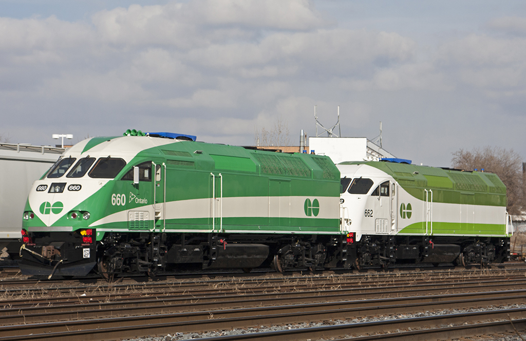 Brand new go units fresh out of factory sit in lambton yard awaiting to be lifted and brought to mimico. Two different paint schemes 660 wearing the traditional GO colours and 662 wearing the new GO colours.