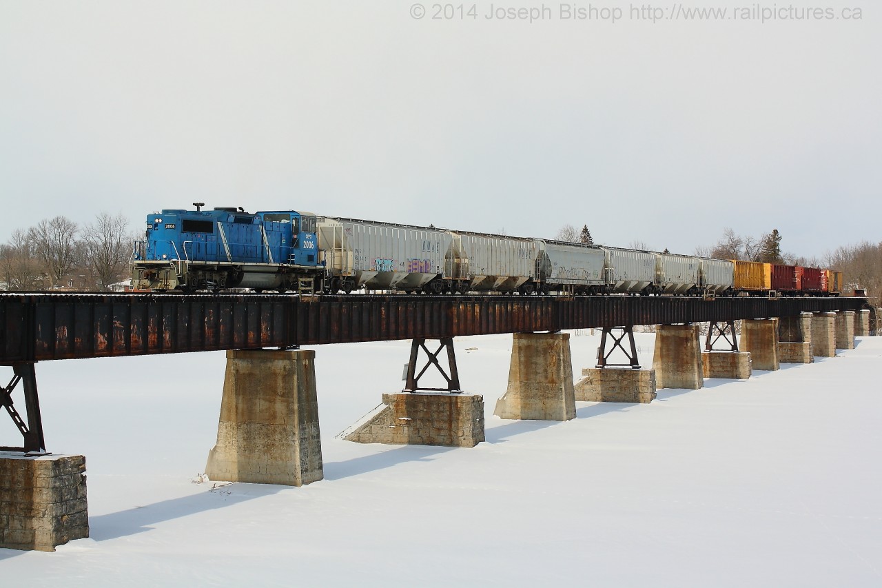 CEFX 2006 leads SOR 595 across the Grand River at Caledonia with a cut of cars from the local industries in town.