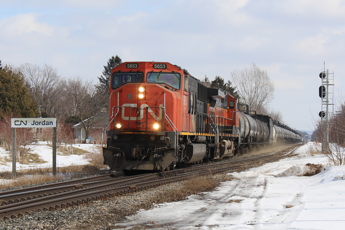 Kicking up some dust, CN 331 hits the Jordan crossover at 60mph with CN 5653, BNSF 1029 and a relatively short train mostly of tankers.