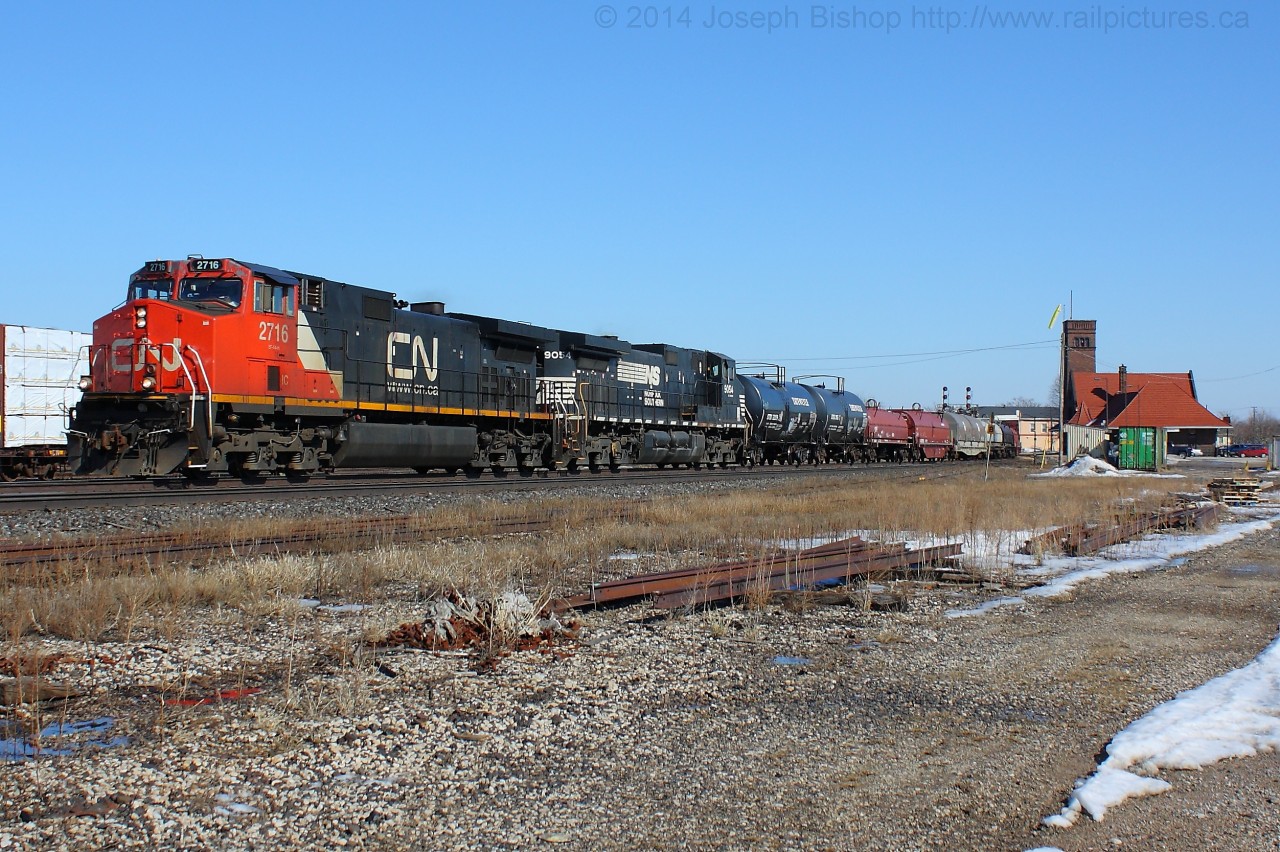 CN 331 makes its way through Brantford with IC 2716 and NS 9054.  331 is usually through during the lunch hour today it was by around 1545.