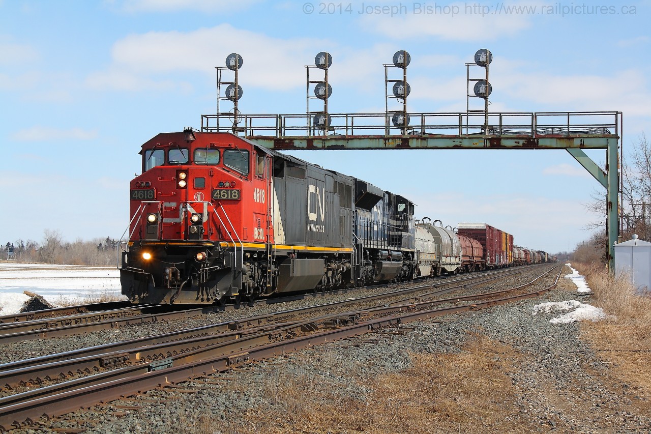 CN 331 comes to a stop at Paris West with BCOL 4618 and CN 8100.  They would complete their lift from the North Service Track before continuing West.