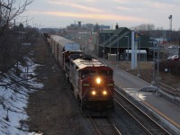 CN 330 heads through St. Catharines with two Dash 8's, 2446 and 2197. It makes it's regular dusk arrival with about 40 cars in length.