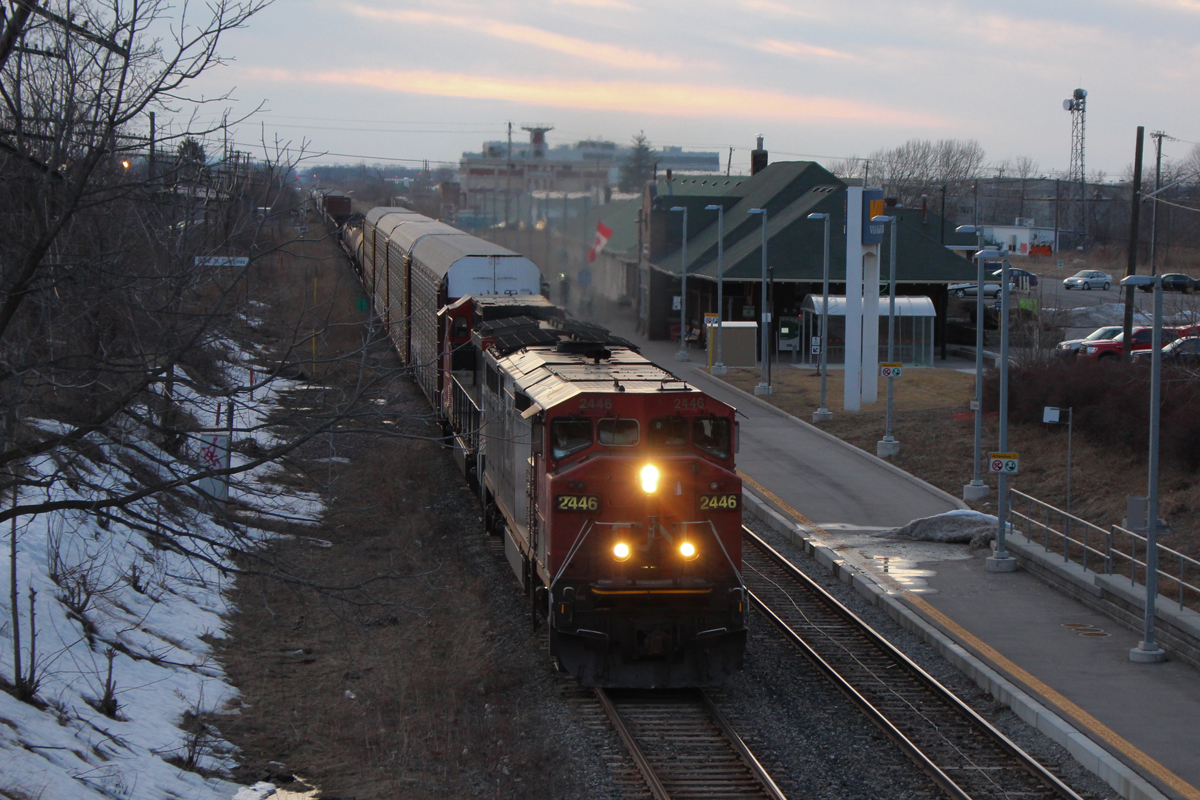 CN 330 heads through St. Catharines with two Dash 8's, 2446 and 2197. It makes it's regular dusk arrival with about 40 cars in length.