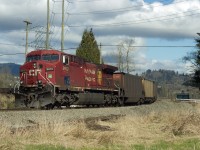 Trailing unit of empty C.P.R. coal train crossing the Fraser River at Abbotsford and Mission, B.C.