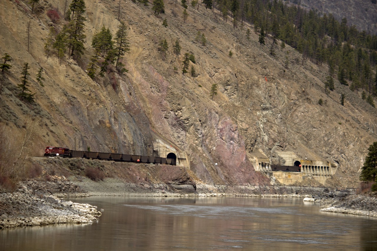 Westbound C.P.R. coal train, on C.N.R. shared trackage, in the Thompson River Canyon near Gold Pan Provincial Park.