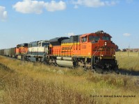 This was a very surprising catch for me. I had just arrived at my railfanning location when I saw this Eastbound BNSF train coming. I quickly got my camera ready and shot a couple photos as it passed. This was my first SD70ACe catch, along with my first SD70MAC. The ES44AC I caught two days earlier heading the opposite direction.
To see this kind of foreign power all at once is very rare. This photo was submitted to and accepted by Canadian Railway Observations, and was posted on their November 2013 edition.