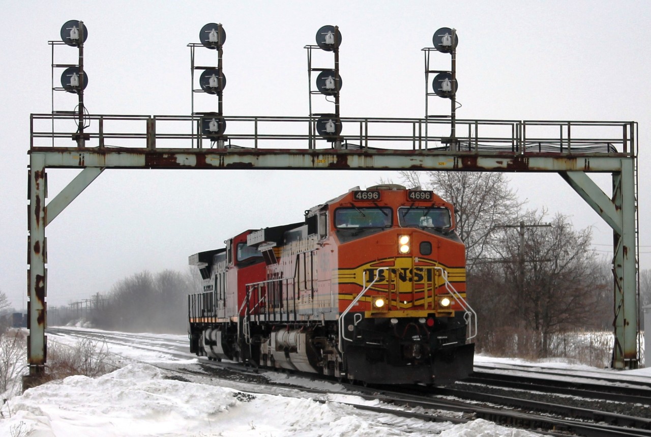 Having seen the train through Paris Junction I drove to catch it switching on Paris Yard. The locos were running forward under the distinctive signal gantry light before reversing into the siding to pick up cars.