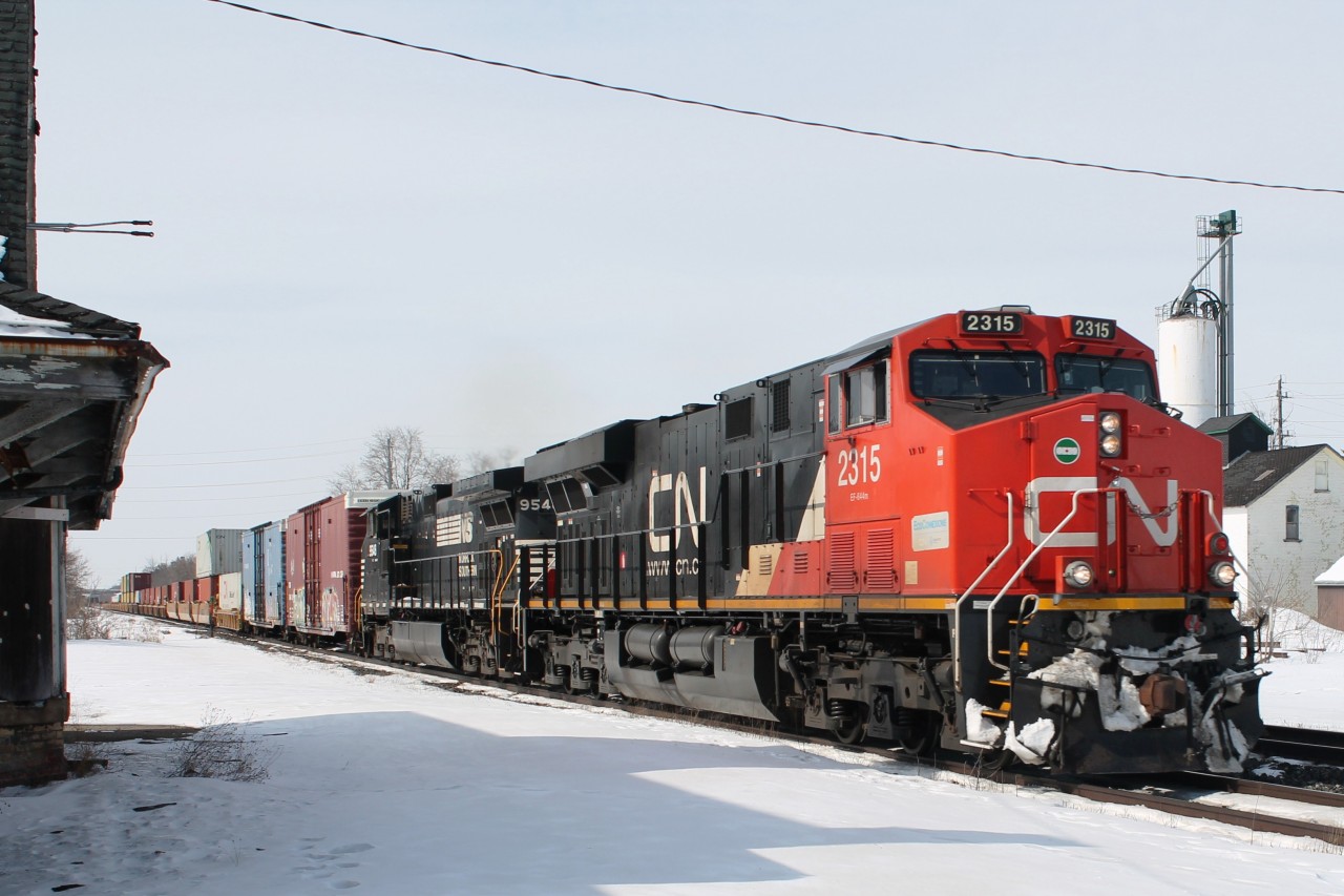 CN2315 and NS9548 hauling an eastbound freight on the south track in front of the old Ingersoll Station.