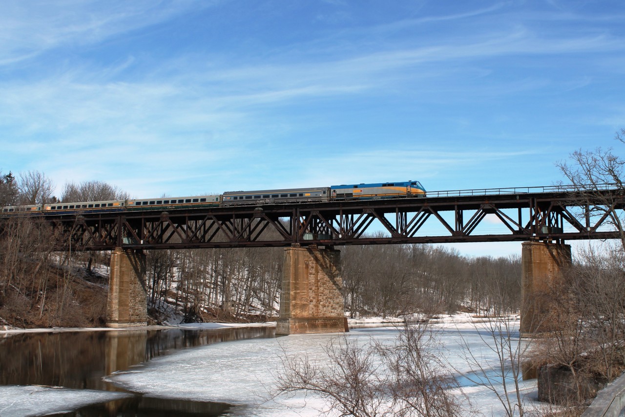On the first full day of spring I tried to catch a train on the viaduct with the last ice still showing on the Grand River. One day I will catch a freight on the bridge!