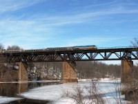 On the first full day of spring I tried to catch a train on the viaduct with the last ice still showing on the Grand River. One day I will catch a freight on the bridge!