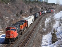 As the sunny +13 degrees March weather comes, I am able to head down to Hilda for a few hours to watch some trains. In a short time, we get this train lined and we see it come around the bend as we take our photos. For those who dont notice, this train has some American friends on board. Trailing is a BNSF SD70M, coming from the United States on lease to Canadian National. This is somewhat rare and pleasant to see, but with the recent FPON rush here in southern Ontario on both CN & CP, this is a fairly common sight.