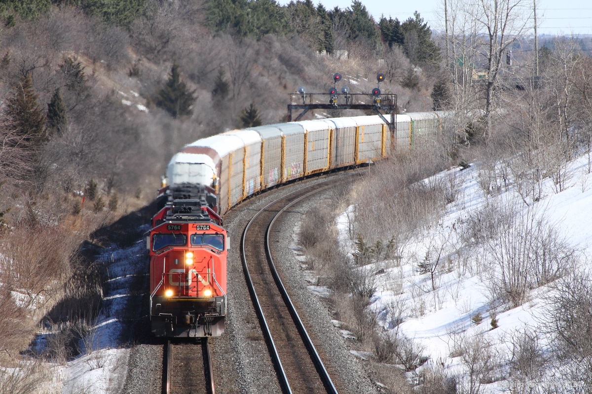 In the sunny March weather, preparing for tomorrows -19 weather, I am able to go film a few trains at the Hilda road bridge, here is my 2nd and final catch, 373 heading west with a 3 unit lashup, 5764, IC 1012, and a SD70M-2 behind that. Although there could have been more trains, it was a fairly decent day out today.