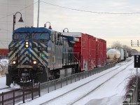 CEFX 1057 solo is in charge of a westbound mixed freight train passing by Dorval station. To the right, CP Train 301 waits for its clearance with a CP-CP-UP-UP consist. Unfortunately I couldnt get a photo of that one.