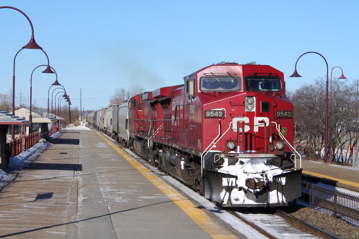 CP 302, a grain train passes Dorval AMT station with 2 AC4400CWs "toasters". The train arrived at its destination, at Montreal, QC minutes later. Defiantly,yesterdays 302's power was better, UP leading and UP as DPU. They returned on 301 later that day packed between a GE and EMD, but unfortunately I didnt get a photo of them.