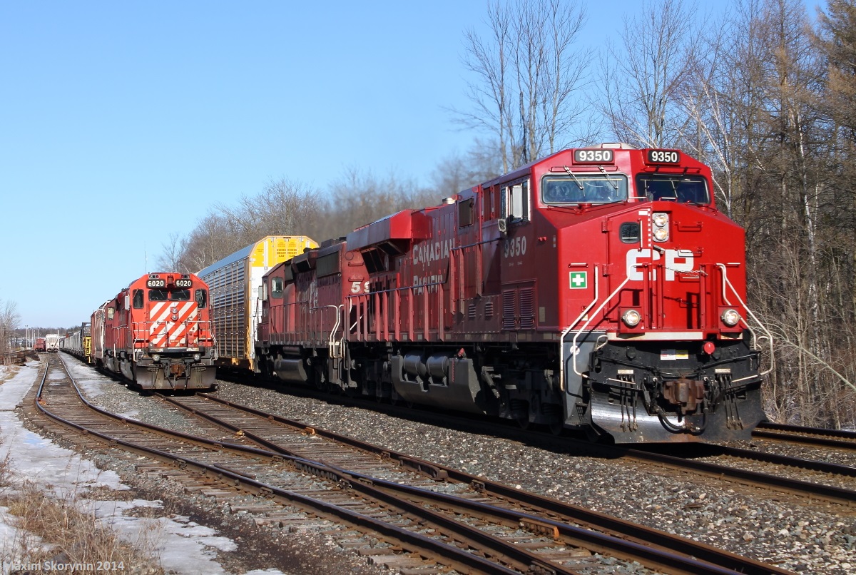 CP 147 passes stopped CP CWR (Rail Train) on the left. Behind is 255 with FPON.