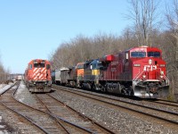 One digit less, it would have been the crazy eights unit! CP 255 with some foreign power from America, including trailing Iowa Chicago & Eastern Railway and Burlington Northern Santa Fe Railway, passes stopped CP CWR (Rail Train) on the left stopped at Guelph junction.
