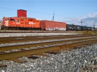 The Dorion Turn is stopped at Dorval; soon a westbound with CP 8775 & CP 9561 will blow by with a long string of intermodal cars. The consist is a GP9 (CP 8228), 5 cars and a caboose (CP 434957). In the foreground is CN's parallel Montreal Sub and the CN/CP interchange track (since removed and relocated a few miles west). For more train photos, click <a href=http://www.flickr.com/photos/mtlwestrailfan/>here.</a>