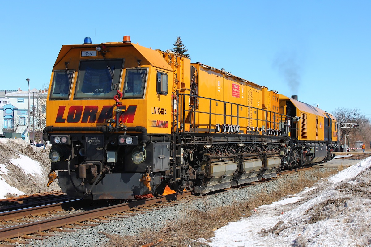 On my way downtown to catch CP 644 on its way from Detroit Michigan I noticed that I was pacing a rail grinder. I beat the train to one of my preferred crossings and watched as RGS1 (LMIX 604) worked its way West on the CP Windsor Subdivision two crossings at a time. This is one of the smaller rail grinder trains that LORAM has used to do crossings and switches that the larger trains don't get.