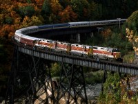 Southbound Agawa Canyon Tour train crosses the trestle over the hydro dam at Montreal Falls.