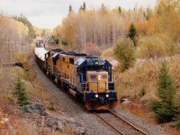 Its a nice bright late fall day as a northbound, having just left Englehart, with ONR 1734, 1806 and 1808 is about to duck under Hwy 112 on its way to Swastika and the junction taking this short train thru Kirkland Lake onward to Rouyn-Noranda. All three units are still in active service as of 2013.