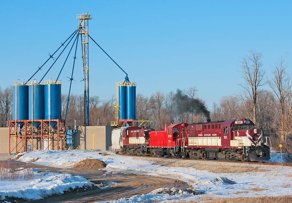 Not often can you shoot OSR in perfect evening light but today was the day, working late, three Ontario Southland Railway units pull out after switching Sanimax.