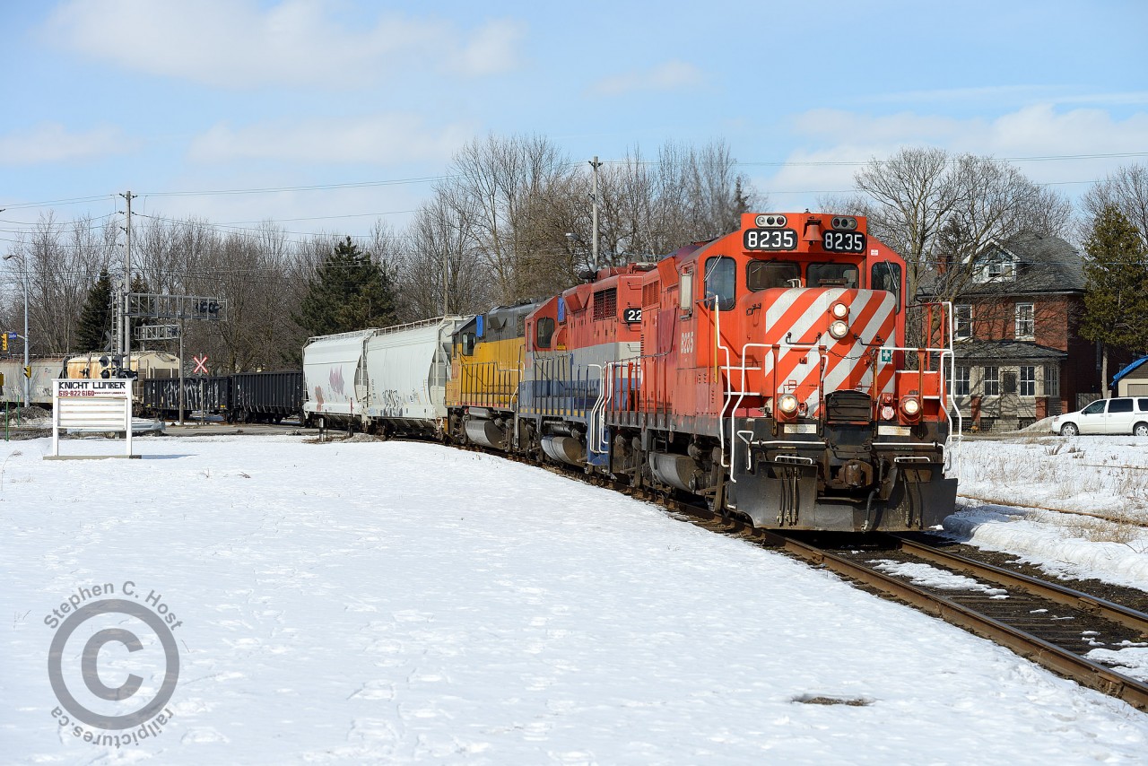 A reunion of sorts -  OSRX 8235 (CP 8822) and RLK 2211 (CP 8210) reunited on the Goderich-Exeter.. Note that this photo is only possible today due to Knight Lumber buildings coming down after they closed in 2011. Land is CN owned and was leased for 107 years. A station occupied a site just to the right of the photographer when this was the terminus of the Great Weatern Railway branch from Lynden to Guelph via Galt/Preston/Hespeler from 1855-1870's.