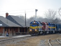 Place the shot! Bill says - At the old Galt Station, which last saw passenger service in 1970 yet still sees company service as a Freight office, RP.CA contributor <a href=http://railpictures.ca/author/corncitymofo>Bill Miller</a> waves as a foreign Dakota Minnesota and Eastern leader - rare for these parts - roars past with three unrebuilt sd40-2's for power. Thanks for the well timed advice, Bill.