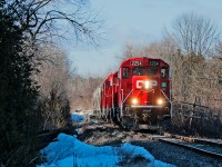 Built as the original mainline to Glen Tay from Toronto for the Ontario and Quebec Railway,  CP 2254 East trundles along on what's left of the Havelock Subdivision with 5 empty hoppers for the nepheline syenite mines in Nephton, Ontario. Although track speed between mile 178 and mile 94.3 is 30 MPH, a 10 MPH rule 43 blankets the section making this a slow trek back to Havelock for the crew.