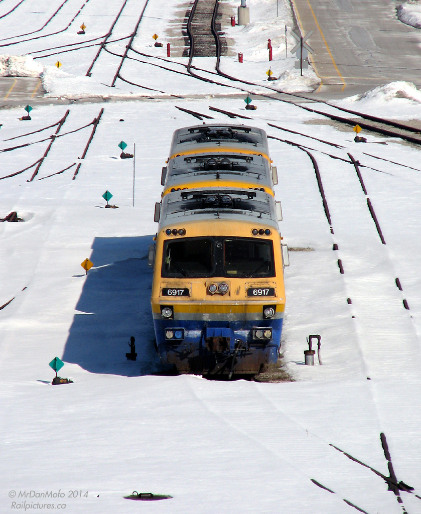 Resting (or rusting) alone in Mimico at VIA's Toronto Maintenance Centre, a trio of retired LRC locomotives sit awaiting their fate. Developed in the 60's and 70's after extensive research and testing by Alcan, MLW, CN and Dofasco (and built in the early 80's for VIA Rail), the LRC concept envisioned high-speed lightweight aluminum-bodied trains for corridor service between Windsor and Montreal. While they were somewhat successful after initial teething problems, and the LRC passenger car fleet still serves as the backbone of the corridor today, the LRC locomotives weren't very long-lived: the majority were retired in the 90's, with the last few stragglers operating until December 2001.

The bulk of the LRC loco fleet was sold off to IRSI and later scrapped. A few lingered at VIA ,stored at various properties until a housecleaning in 2010. 6903 and 6905 were sold to Diesel Electric Services in Sudbury a number of years back (for foreign export conversion that was half way complete before being canned, see painted 2007 & primer grey), 6907 was stored in Montreal (scrapped at CAD in late 2010), and 6921 donated to CRM/Exporail in St. Constant QC. And then there was 6914, 6917 & 6919 that sat languishing with the other junque at Mimico for eons.

A campaign to save an LRC for local preservation would see the unit in the best shape, 6917, saved for the Toronto Railway Heritage Association. VIA 6914 would be sent to Montreal for scrapping (by CAD / RB Recycling) in late 2010. 6919, which proved to be unsuitable to move east, would be picked over for spare parts for 6917, and then the carcass cut up for scrap by a demolition excavator in January 2011.